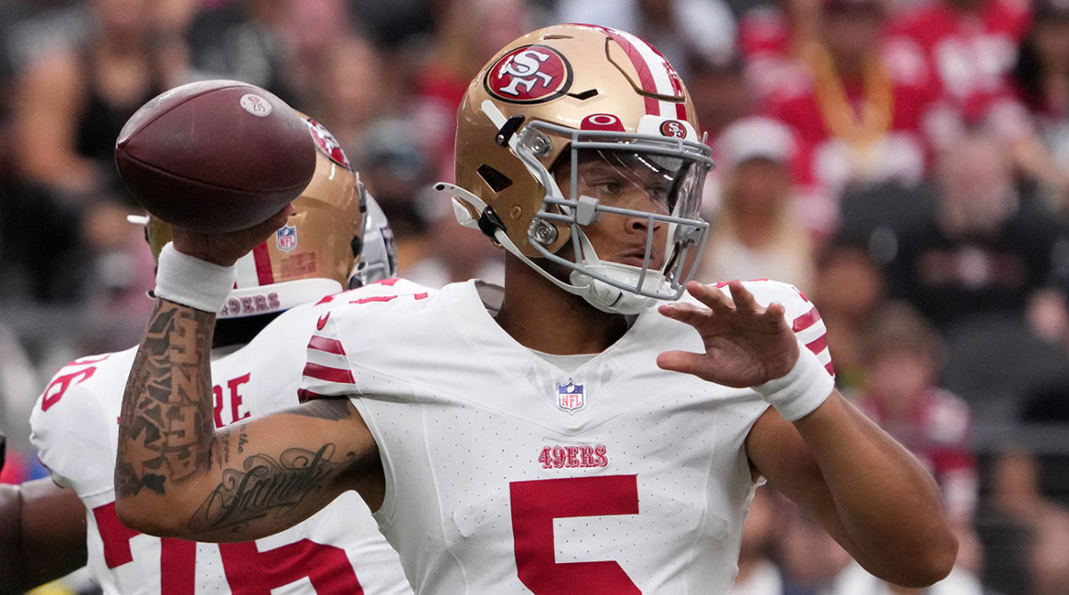 Trey Lance throws a pass for the 49ers